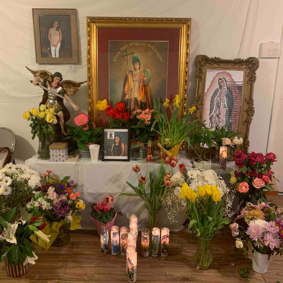 flowers surround photos of Magana Bedolla