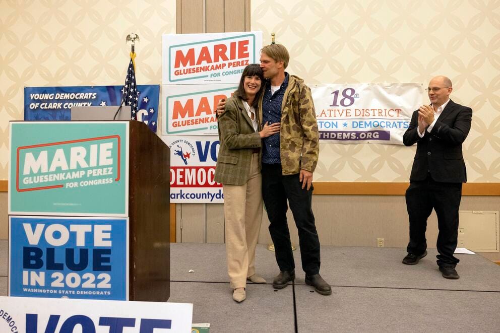 Marie Gluesenkamp Perez embraces her husband after winning election in 2022