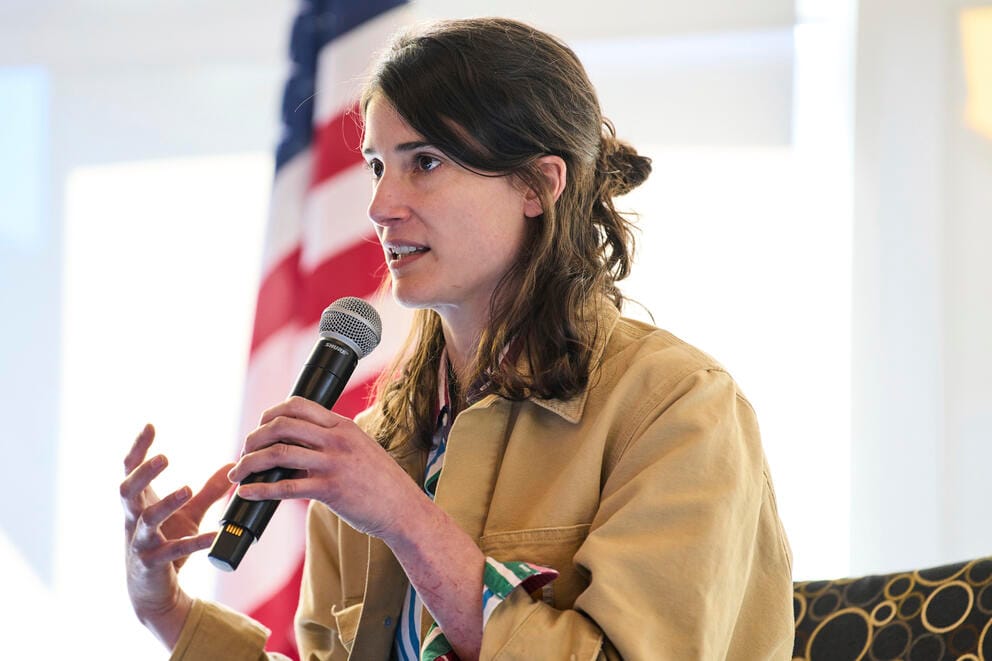 Marie Gluesenkamp Perez speaks into a microphone.