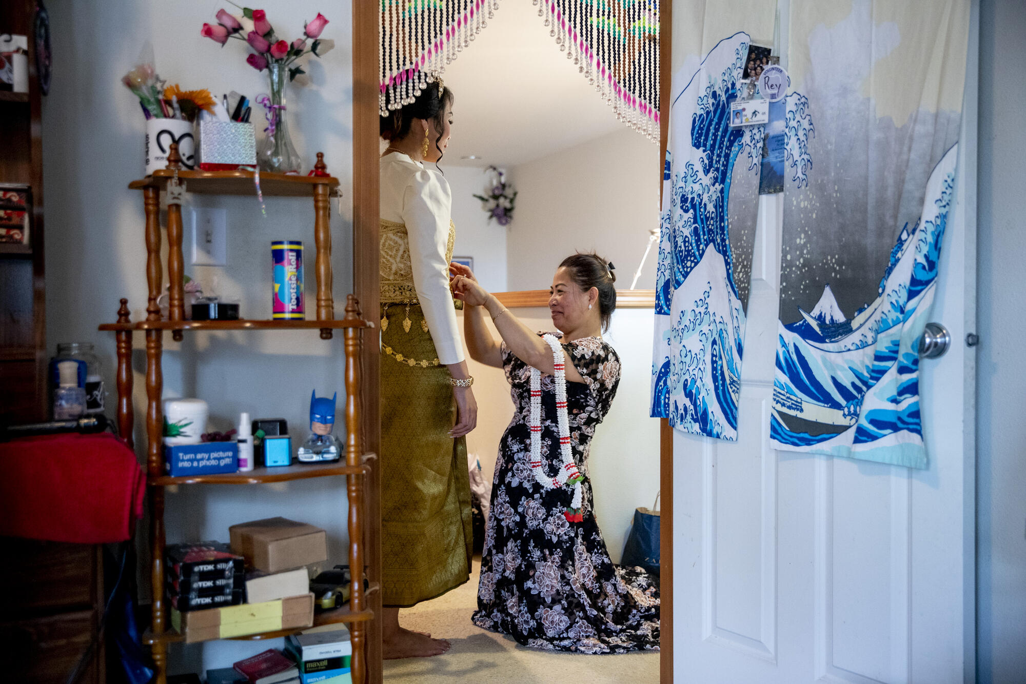 Nary works on a wedding outfit