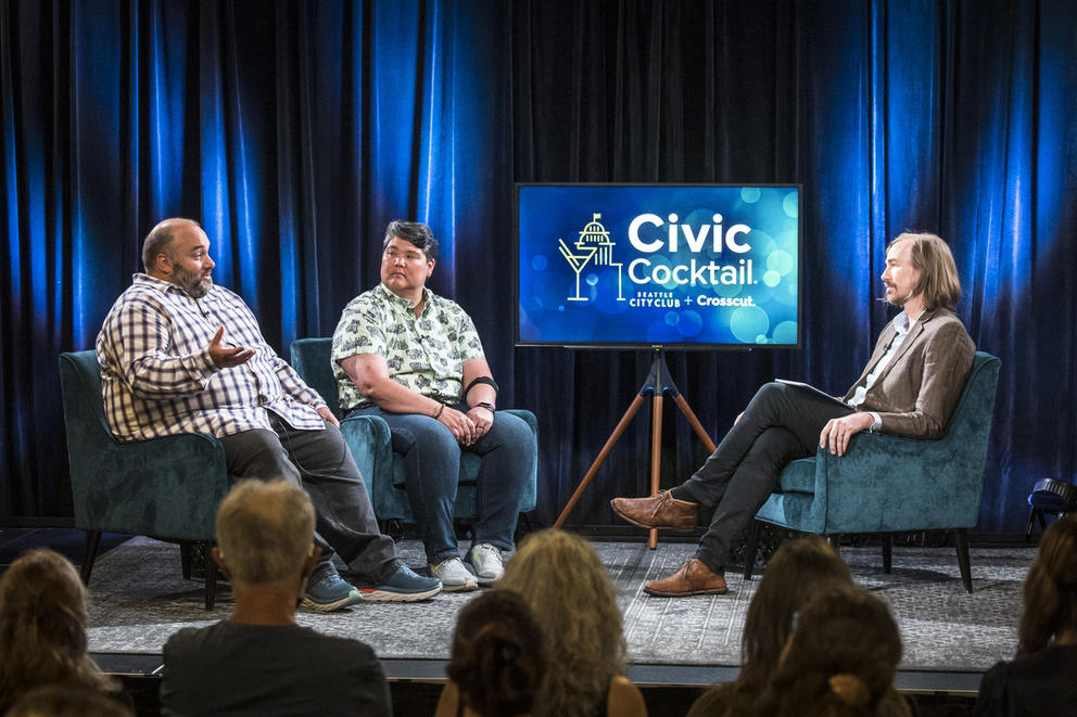 Two guests and a host on stage