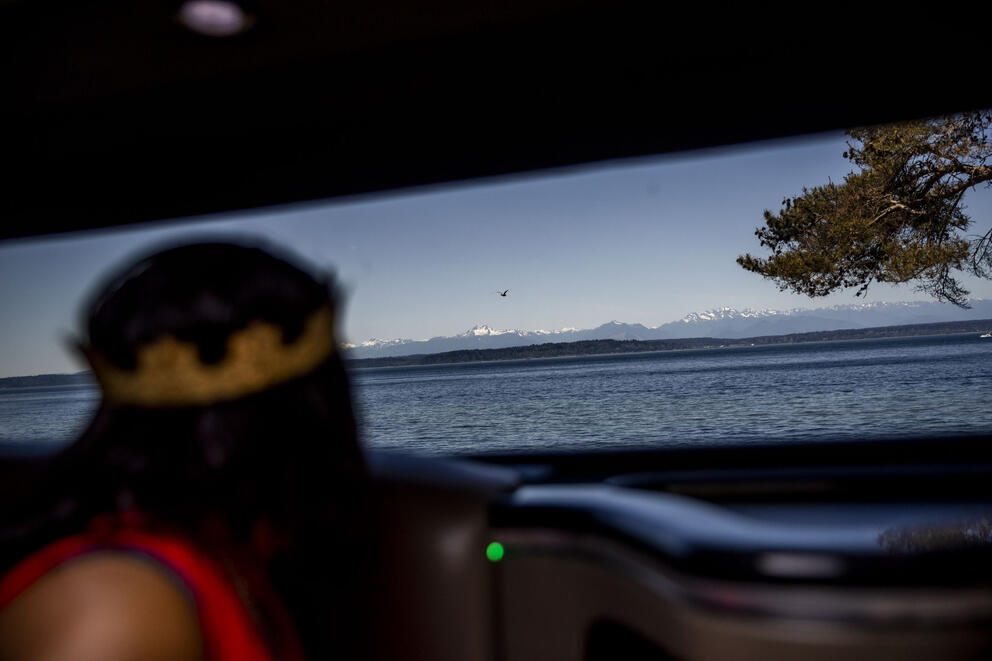 Alesia looks out the window of a stretch Hummer