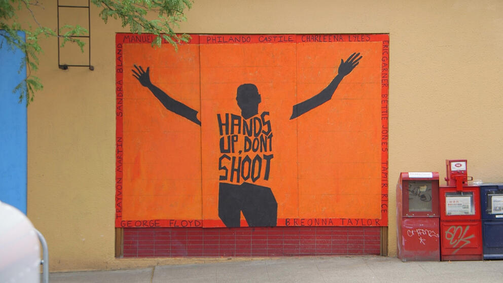 Mural with "Hands up don't shoot"