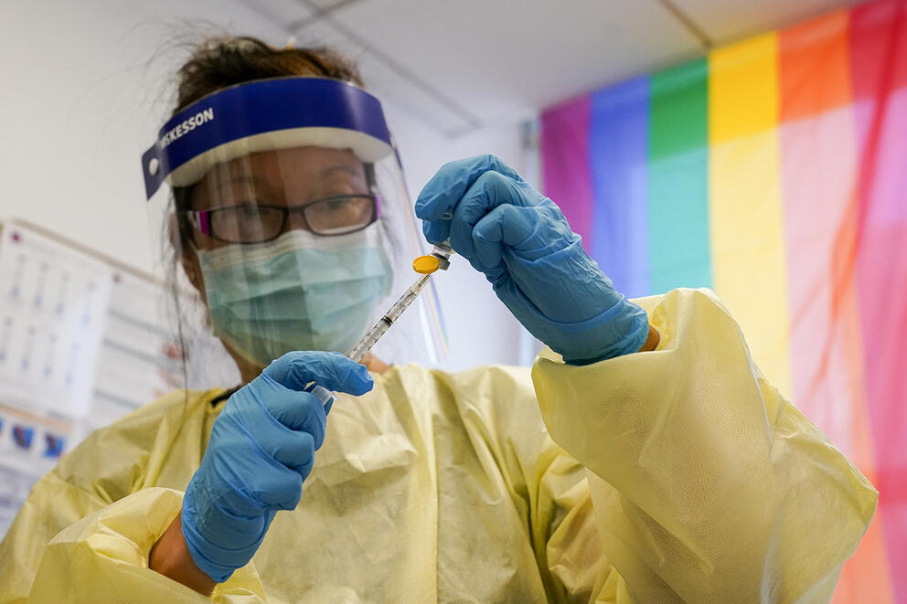 Physician Assistant Susan Eng-Na prepares a syringe with the monkeypox vaccine