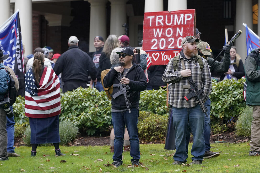 protesters standing outside of the governor's mansion