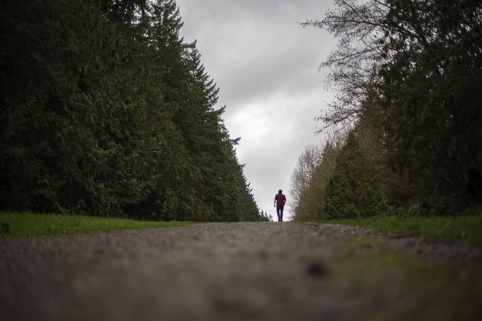Nathan Lambrecht walks along a trail in Woodinville, Washington,
