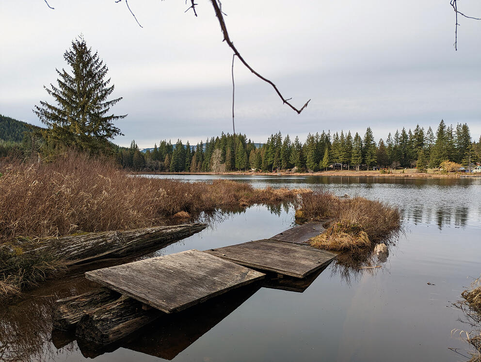 A dock at a lake.