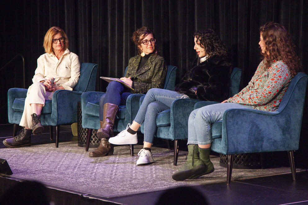 Holly Morris, Sara Bernard, Lana Ikelan and Noga Bar Oz sit on stage.