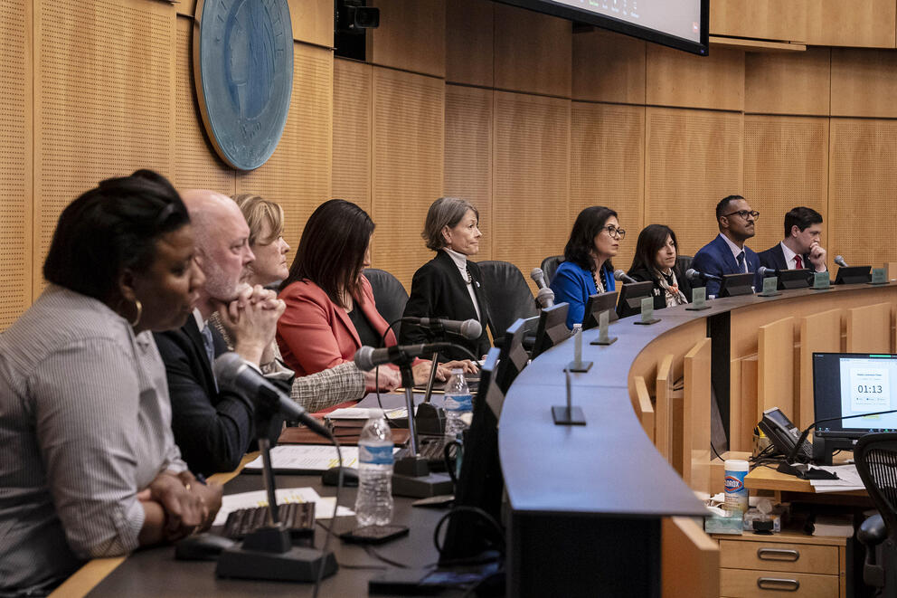 city councilmembers sit behind the dais in seattle city hall