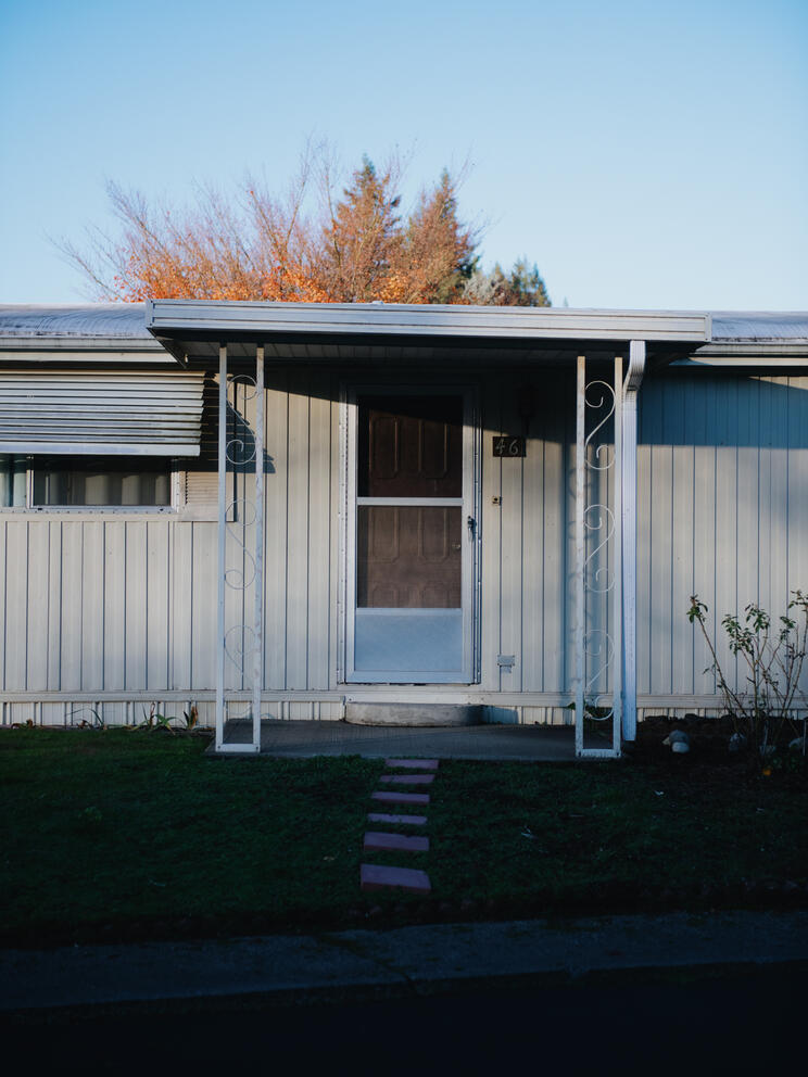 A baby blue mobile home pictured in Tumwater, Washington in the late fall.