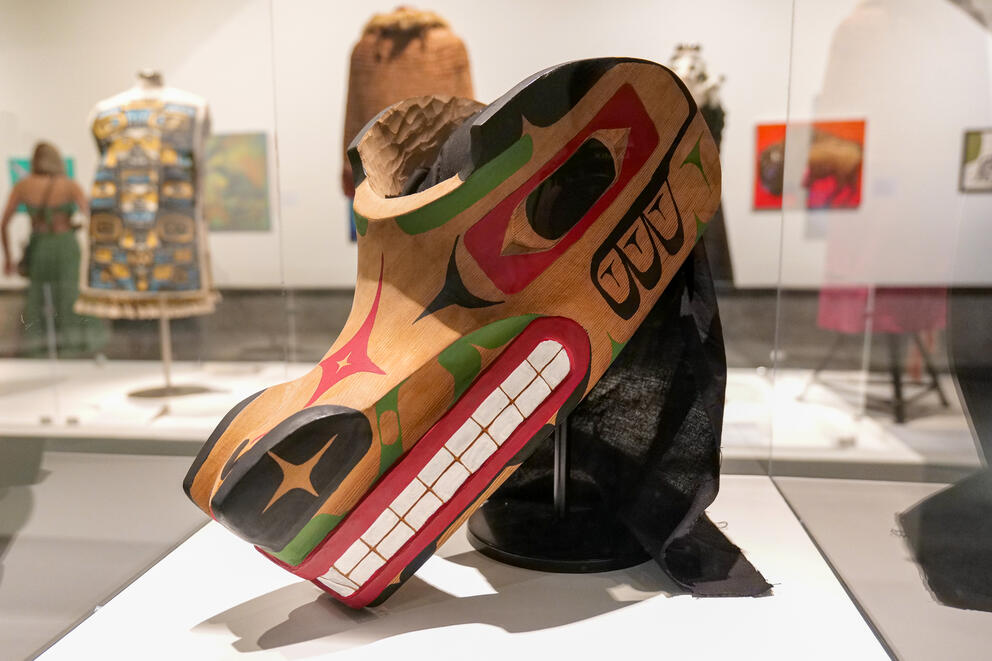 photo of a native american wolf headdress carved in the traditional formline style