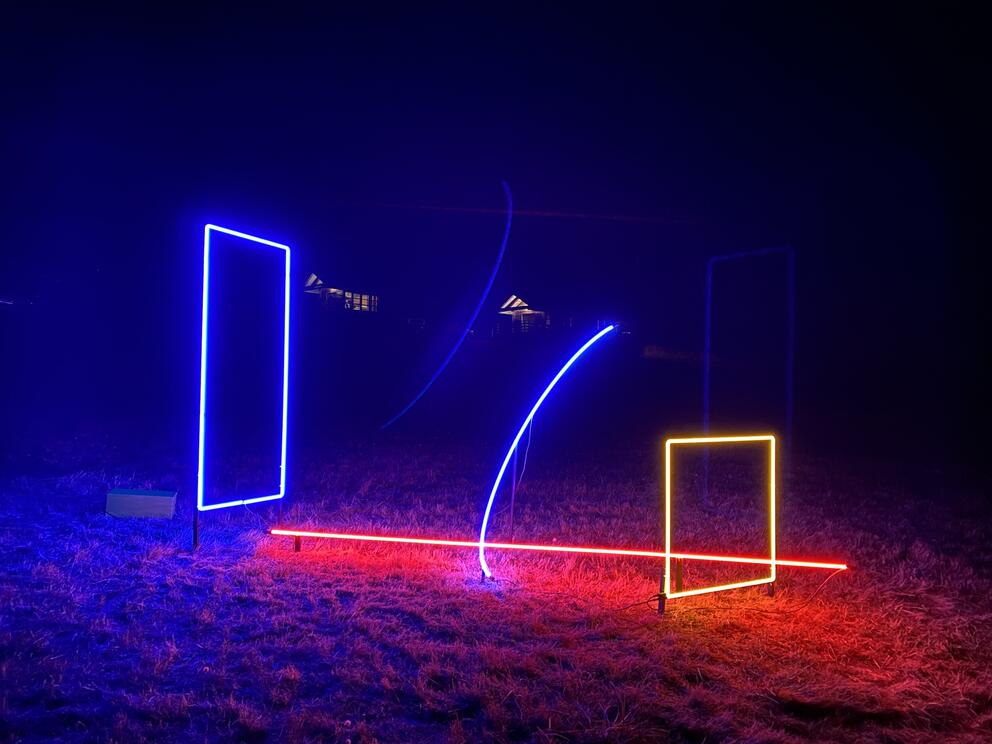 neon shapes in the dark, including a purple vertical rectangle and orange square