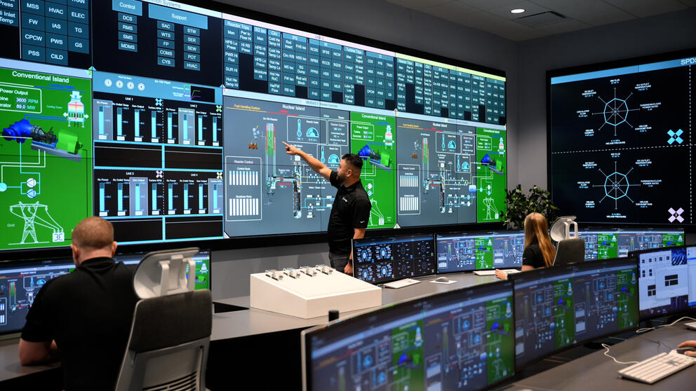 Workers in an X-energy control room. 