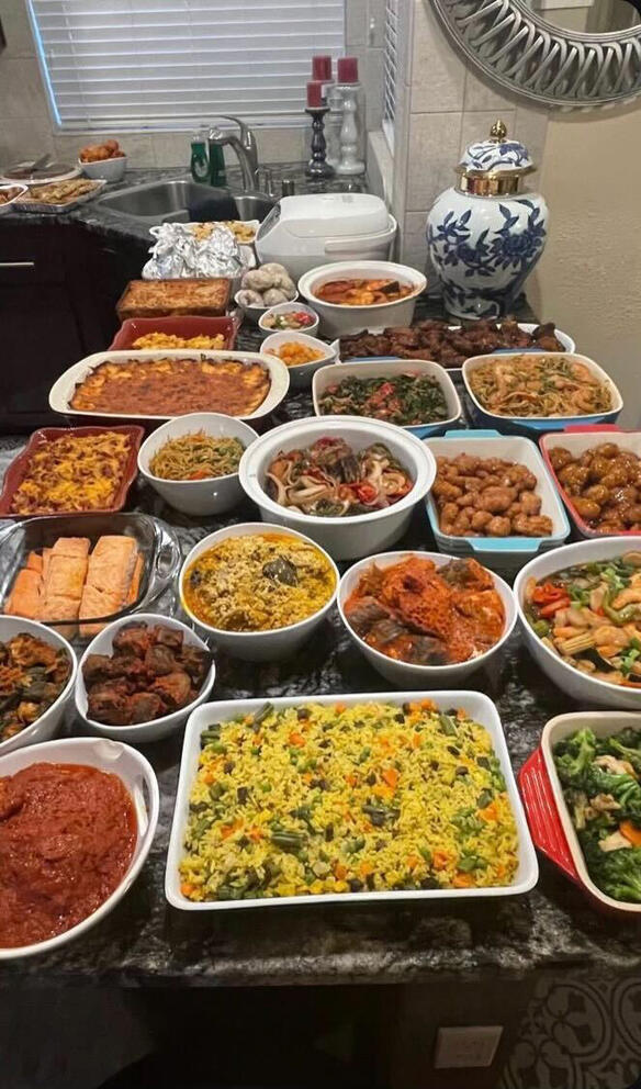 Rachel Izuagbe, a Nigerian-American in Lacey, said her family’s Thanksgiving last year included coconut riuce, moi moi (wrapped in foil in the top left), pounded yam (wrapped in plastic), mac and cheese, shrimp, chicken wings, collard greens, noodles, mashed potatoes with bacon, onion crisps and cheese, Nigerian fish dishes, salmon, egusi soup, stew, orange chicken, liver, Nigerian fried rice and broccoli. (Photo courtesy of Rachel Izuagbe)