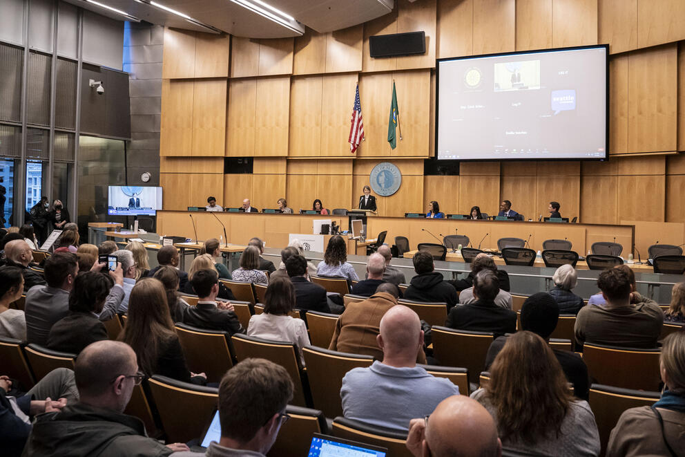 people sitting in the city council chambers