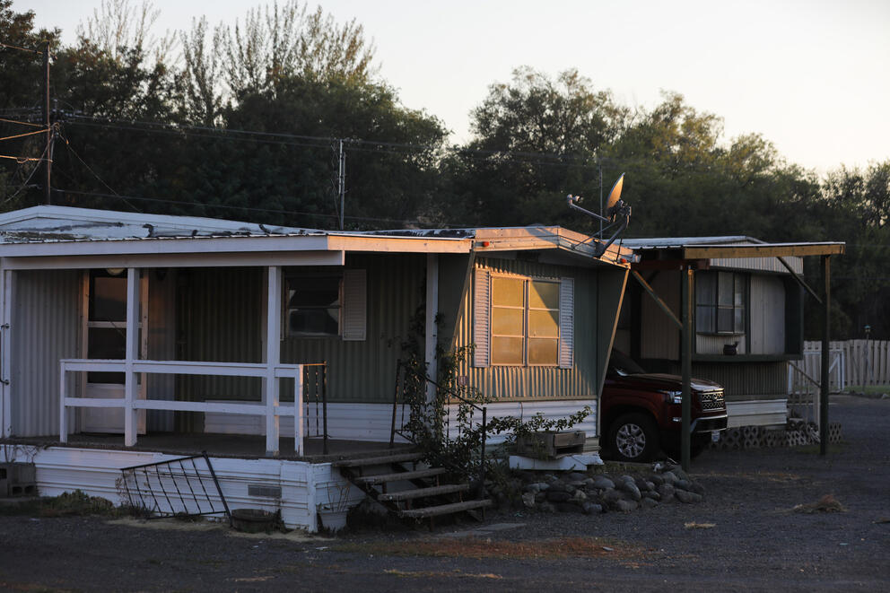 Evening sun hits the side of a mobile home