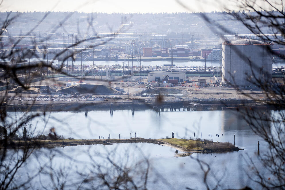 An energy facility located next to a body of water.