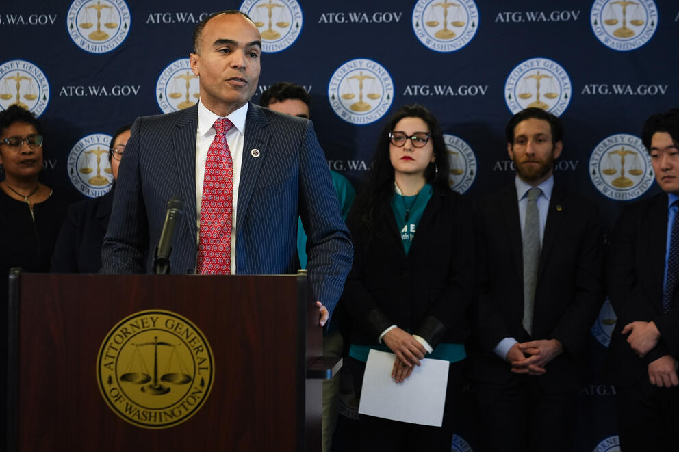 a group of people stand behind a podium