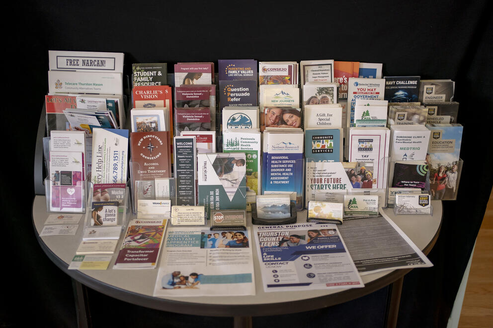 Brochures and service literature sit crammed on a round table
