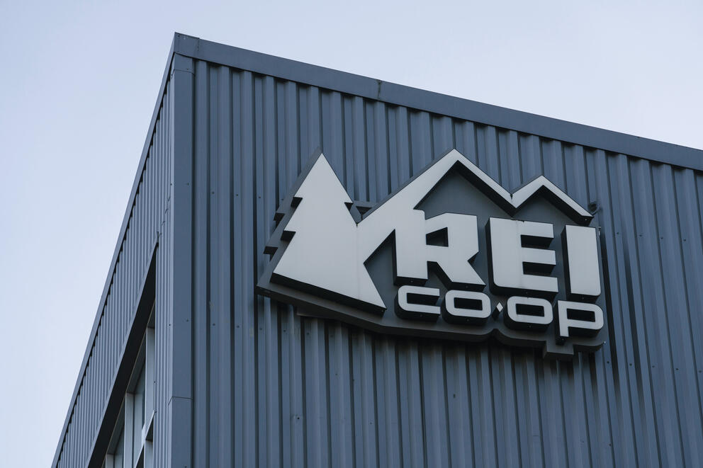 A logo on a building says "REI Co-op"