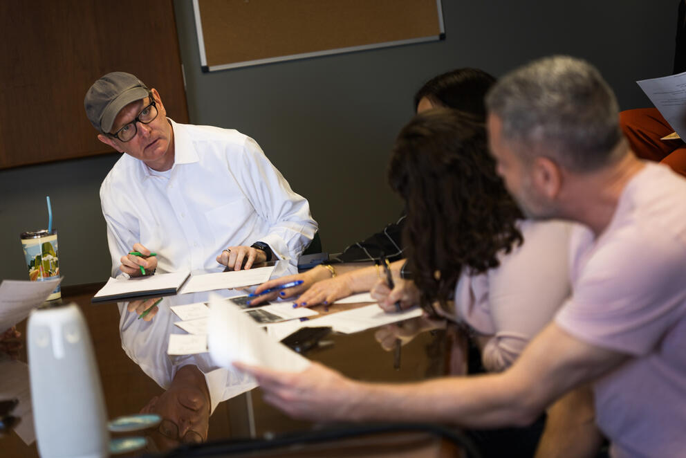 Editor Rob Curley leads the daily news meeting