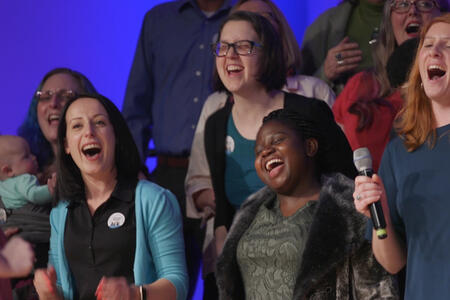 Tacoma Refugee Choir members singing together.